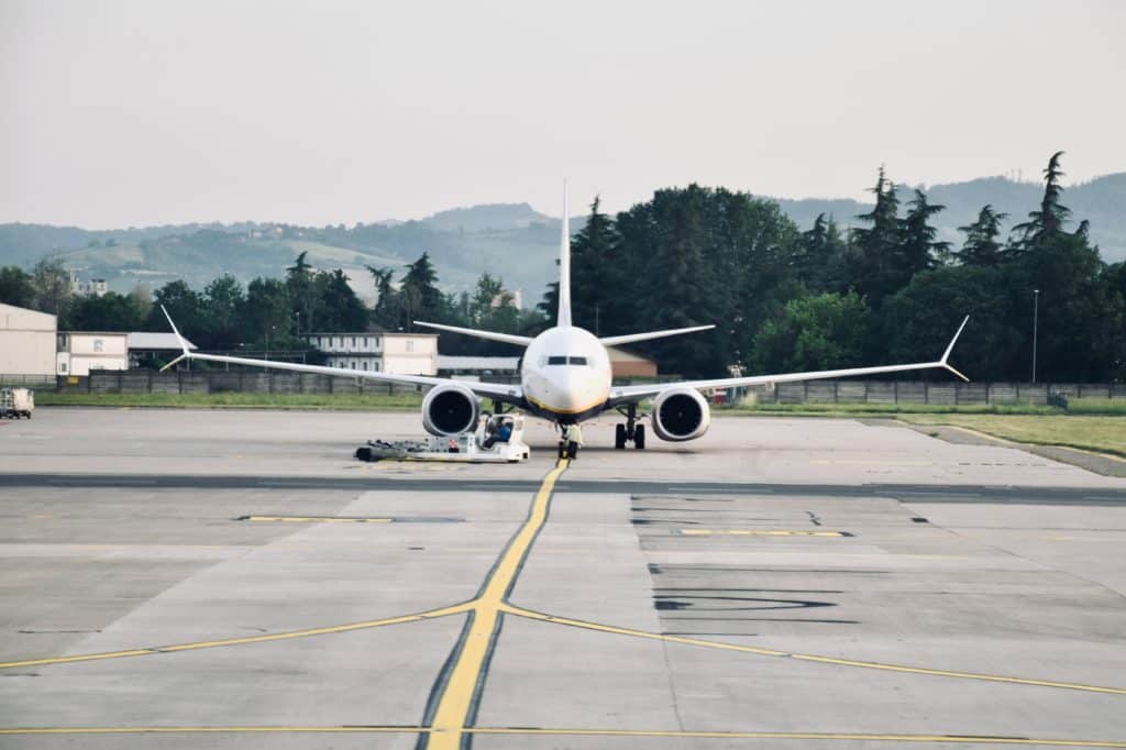 Boeing 737 sitting on the tarmac awaiting pre-flight inspection.